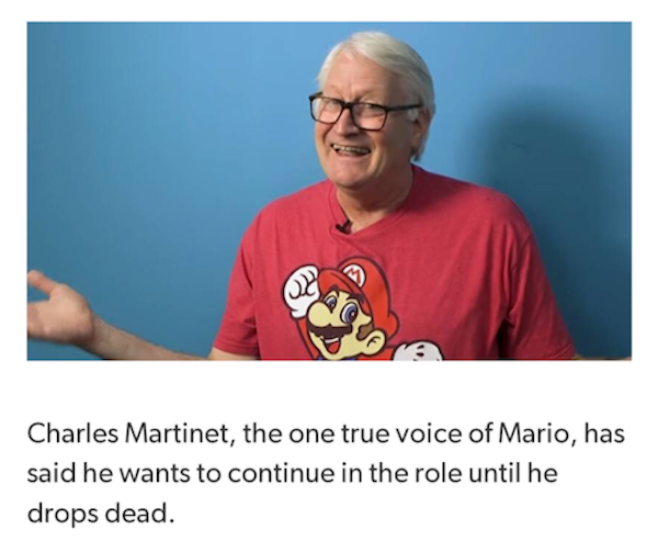 photo from a news article with a picture of Charles Martinet, a white-haired guy in a red t-shirt with Mario on it, with his hands out in a sort of 'what can ya do' shrug. the headline reads: 'charles martinet, the one true voice of mario, said he wants to continue the role until he drops dead.'