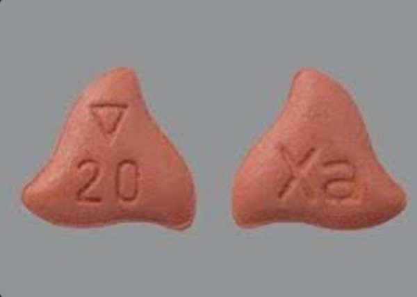 two tablets of 20mg Xarelto. They are brownish-red and shaped like a chubby chibi-version of the insignia of the Klingon empire. there is really no other description.