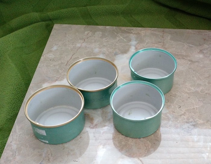 4 small cat food cans
