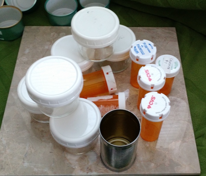 several small cylindrical containers