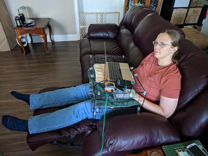 Me using a lap desk made of wire storage cubes 